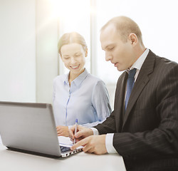 Image showing business team with laptop having discussion