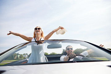 Image showing happy man and woman driving in cabriolet car