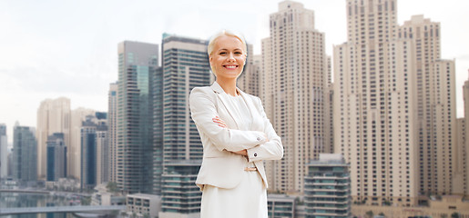 Image showing young smiling businesswoman with crossed arms