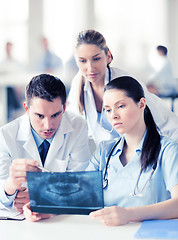 Image showing group of doctors looking at x-ray