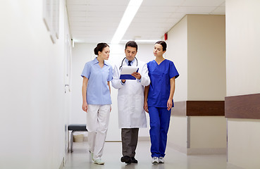 Image showing group of medics at hospital with clipboard