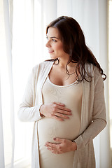 Image showing happy pregnant woman with big tummy at home