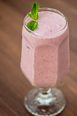 Image showing Strawberry smoothie on table