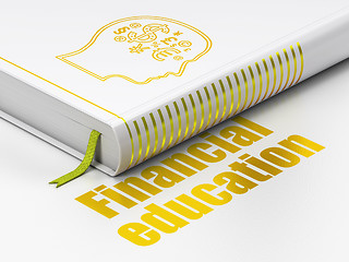 Image showing Learning concept: book Head With Finance Symbol, Financial Education on white background