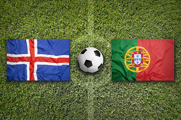 Image showing Iceland vs. Portugal flags on soccer field