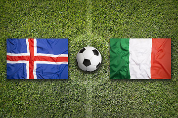 Image showing Iceland vs. Italy flags on soccer field