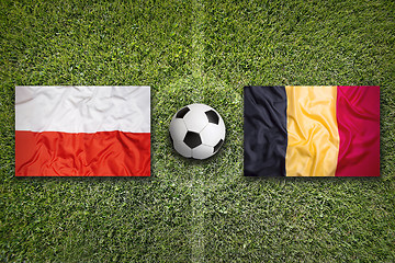 Image showing Poland vs. Belgium flags on soccer field