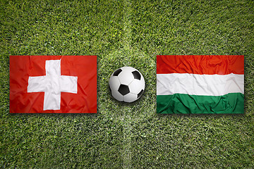 Image showing Switzerland vs. Hungary flags on soccer field