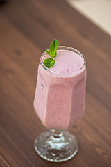 Image showing Strawberry smoothie on table