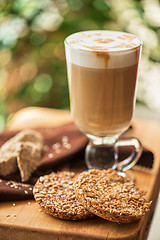 Image showing coffee latte cup with cookies