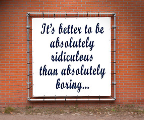 Image showing Large banner with inspirational quote on a brick wall