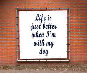 Image showing Large banner with inspirational quote on a brick wall