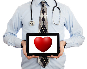 Image showing Doctor holding tablet - Red heart