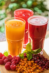 Image showing fruit drink with cranberries raspberries and sea buckthorn