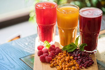 Image showing fruit drink with cranberries raspberries and sea buckthorn