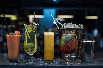 Image showing cocktails on bar background