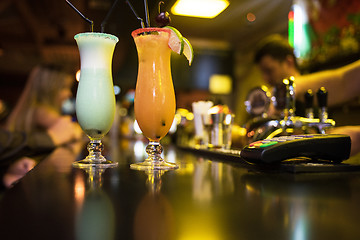 Image showing cocktails on bar background