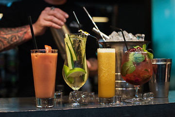 Image showing cocktails on bar background