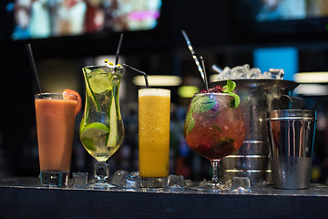 Image showing cocktails on bar background