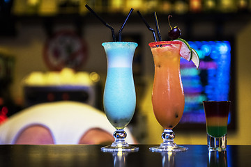 Image showing cocktails on bar background