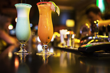 Image showing cocktails on bar background