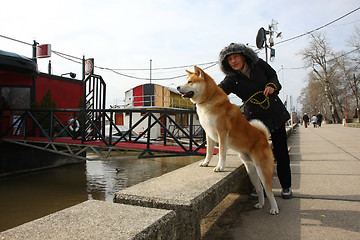 Image showing Lady and her dog