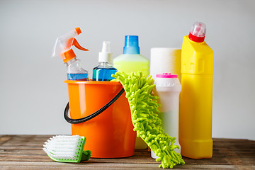 Image showing Bucket with cleaning items on light background