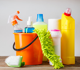 Image showing Bucket with cleaning items on light background