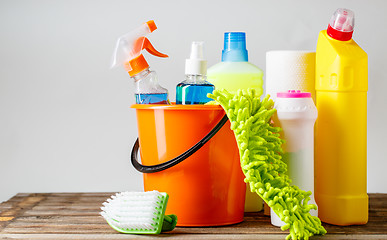 Image showing Bucket with cleaning items on light background