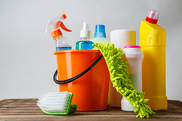 Image showing Bucket with cleaning items on light background