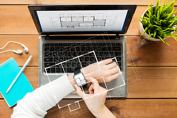 Image showing close up of woman with smart watch and laptop