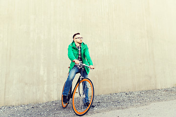 Image showing happy young hipster man with fixed gear bike