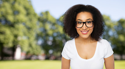 Image showing happy african woman or student girl in eyeglasses