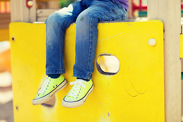 Image showing close up of boy legs on children playground