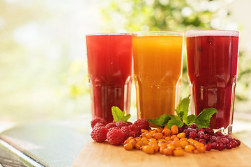 Image showing fruit drink with cranberries raspberries and sea buckthorn