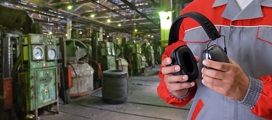 Image showing Worker with protective headphone
