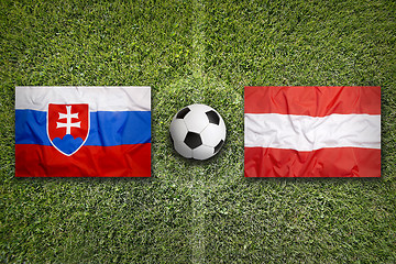 Image showing Slovakia vs. Austria flags on soccer field