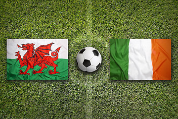 Image showing Wales vs. Ireland flags on soccer field