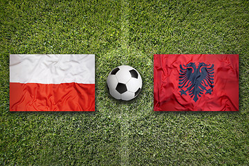 Image showing Poland vs. Albania flags on soccer field