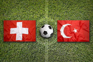 Image showing Switzerland vs. Turkey flags on soccer field