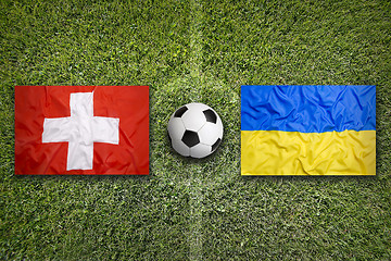 Image showing Switzerland vs. Ukraine flags on soccer field