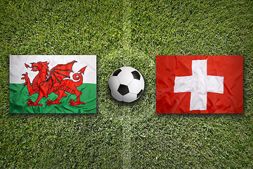 Image showing Wales vs. Switzerland flags on soccer field