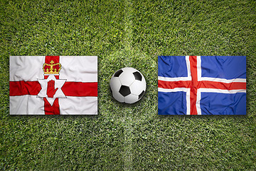 Image showing Northern Ireland vs. Iceland flags on soccer field