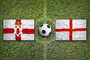 Image showing Northern Ireland vs. England flags on soccer field