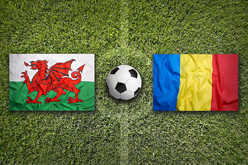 Image showing Wales vs. Romania flags on soccer field