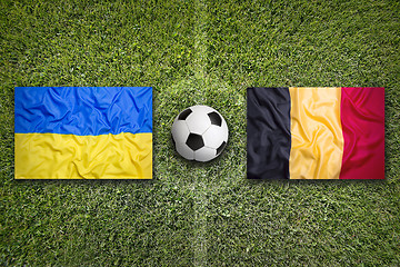 Image showing Ukraine vs. Belgium flags on soccer field