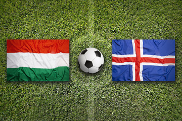 Image showing Hungary vs. Iceland flags on soccer field