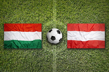 Image showing Hungary vs. Austria flags on soccer field