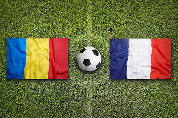 Image showing Romania vs. France flags on soccer field