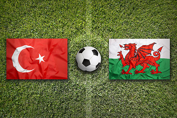 Image showing Turkey vs. Wales flags on soccer field
